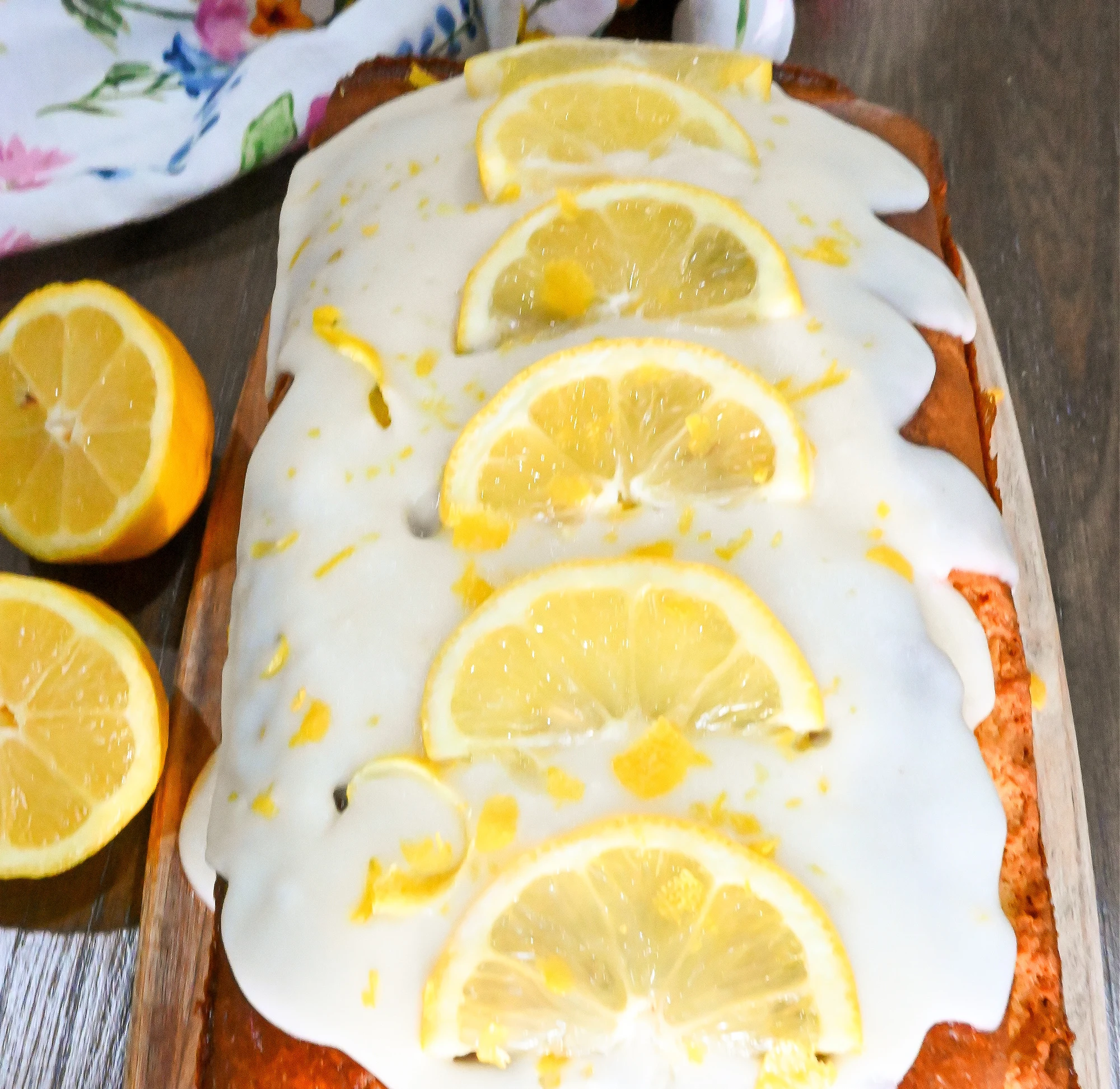https://www.fittoservegroup.com/wp-content/uploads/2016/12/keto-lemon-cake-with-slices-of-lemon-and-lemon-zest-on-top-of-lemon-tangy-icing.jpg.webp