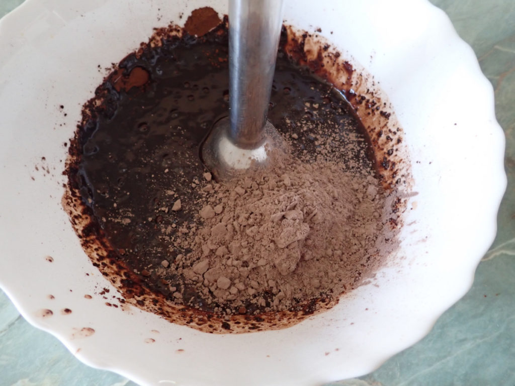 keto fudge being made with an immersion mixer