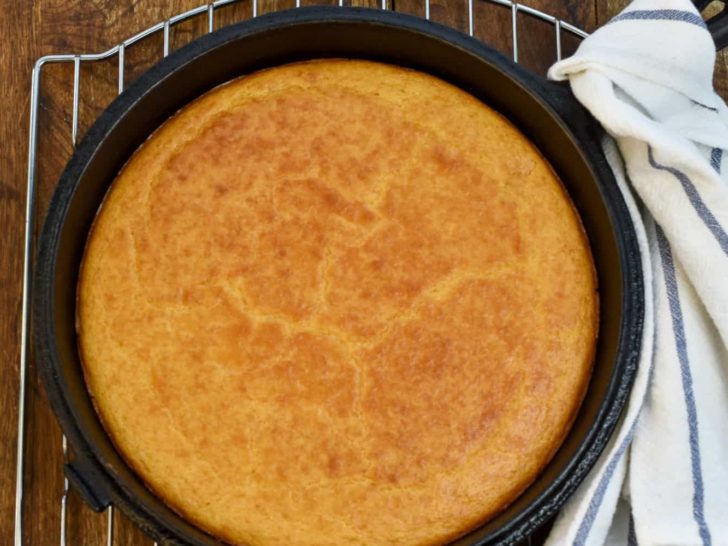 keto coconut flour cornbread in a cast iron skillet on top of baking rack