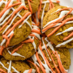 Keto pumpkin cookies stacked on a white plate