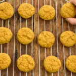 low carb pumpkin cookies cooling on a cooling rack before icing is applied