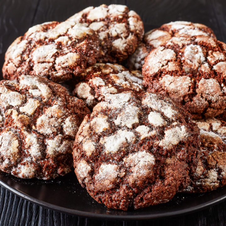 keto chocolate crinkle cookie on a black plate