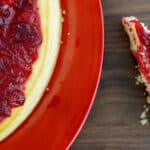 keto cranberry cheesecake on a red plate