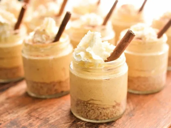 keto no bake pumpkin cheesecake in small mason jars