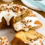 Keto cinnamon cake a bundt cake sliced on a white plate