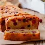 keto pumpkin cranberry bread being sliced