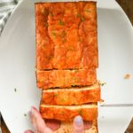 keto kielbasa cornbread loaf being sliced