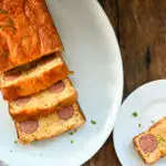 Keto kielbasa cornbread on a white plater sliced