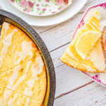 keto lemon ricotta scones in cast iron skillet with scone and tea on pink and white plate