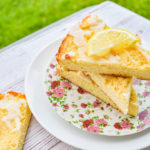 keto lemon ricotta scones stacked on pink floral plate and white plate with more scones on the side