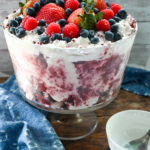 keto red velvet trifle with mixed berries on wooden board