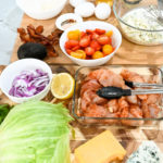 keto Cobb salad ingredients on a wooden board