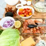 keto Cobb salad ingredients on a wooden board