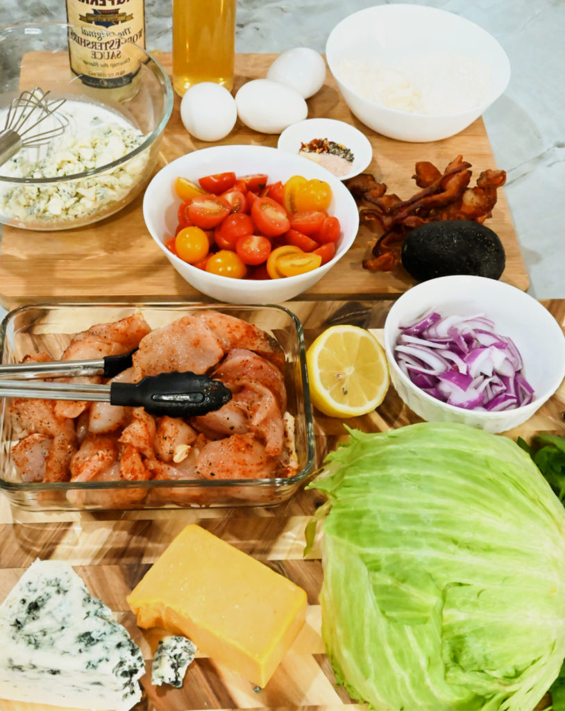 keto Cobb salad ingredients on a wooden board