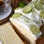 keto key lime pound cake sliced on a wood board