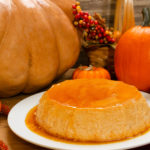 Keto pumpkin flan with pumpkins in the background