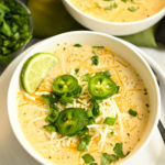 white keto chicken chili served in white bowls