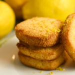 low carb lemon shortbread square cookies stacked on a white plate