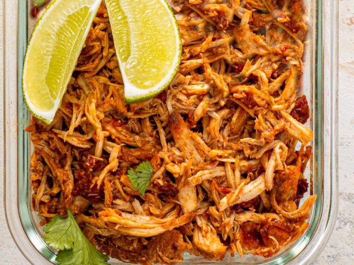 keto Mexican Chicken shredded in a clear pyrex