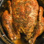 fully cooked whole chicken in a crockpot