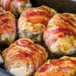 seasoned keto bacon wrapped chicken baked in roasting pan