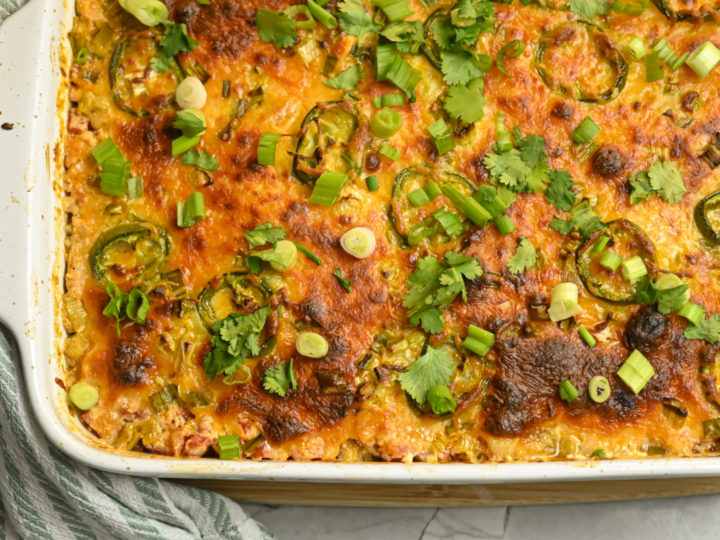 keto chicken taco casserole baked in a white large baking dish