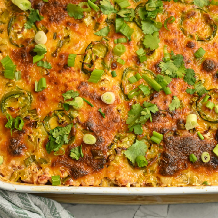 keto chicken taco casserole baked in a white large baking dish