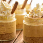 close up image of keto no-bake pumpkin cheesecakes made in small mason jars