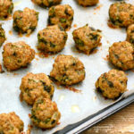 baked keto pastrami meatballs on parchment lined baking sheet