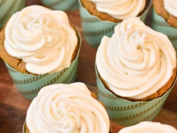 keto carrot cake cupcakes on a wood cake stand 1200