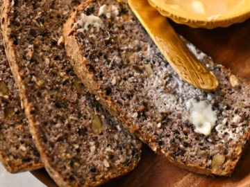 three keto high fiber bread slices with butter on a wooden plate1200